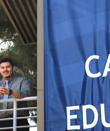 students standing next to Career Education banner