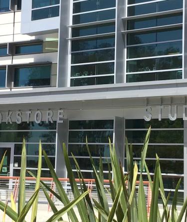 Student Services Building with Cafe and Bookstore signs highlighted