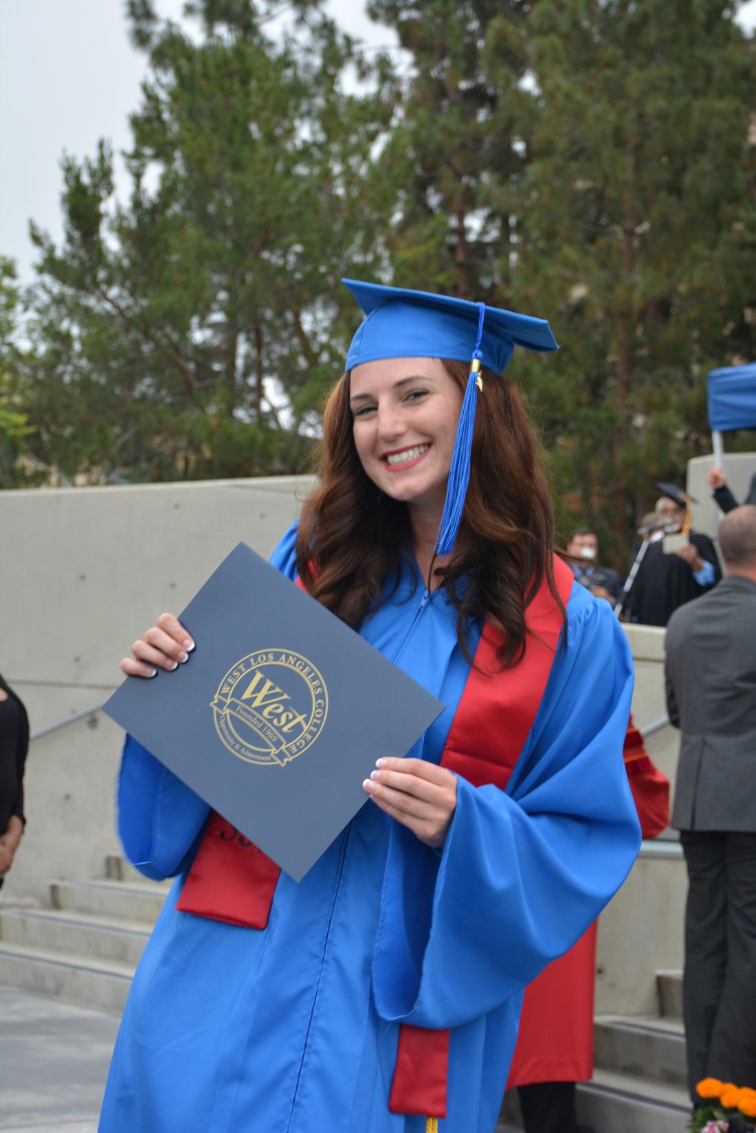 Female Student with Certificate