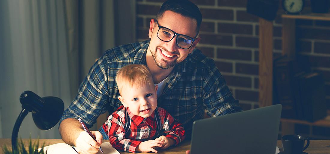 Father with infant son taking online class